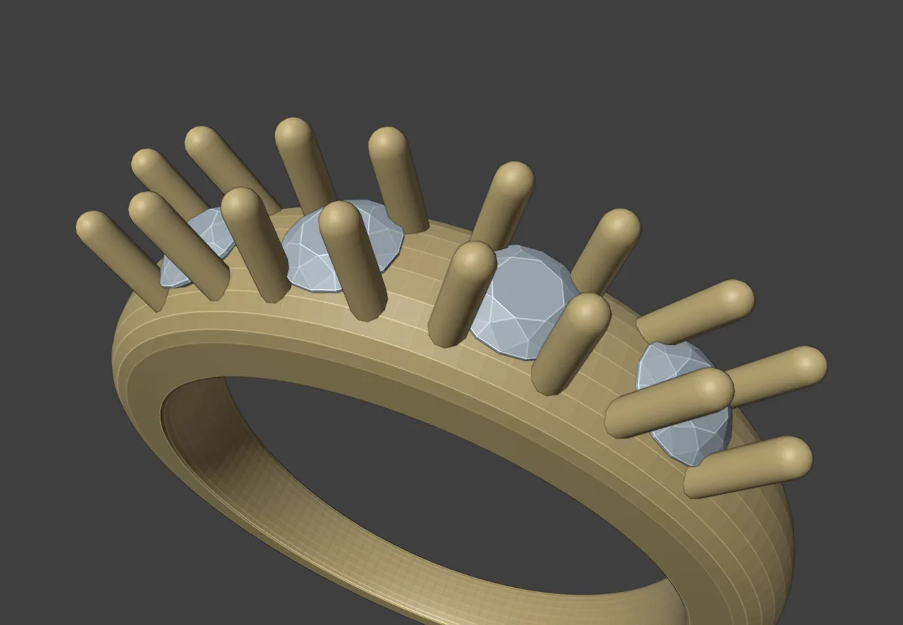 Four round stones on a gold ring band, each held by four round-tipped claws, seen from above and to one side