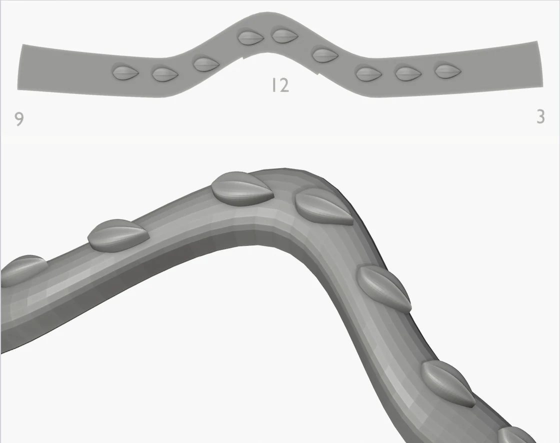 The same wishbone band, fixed: the guide above is the band's true flat shape and the drops land whole