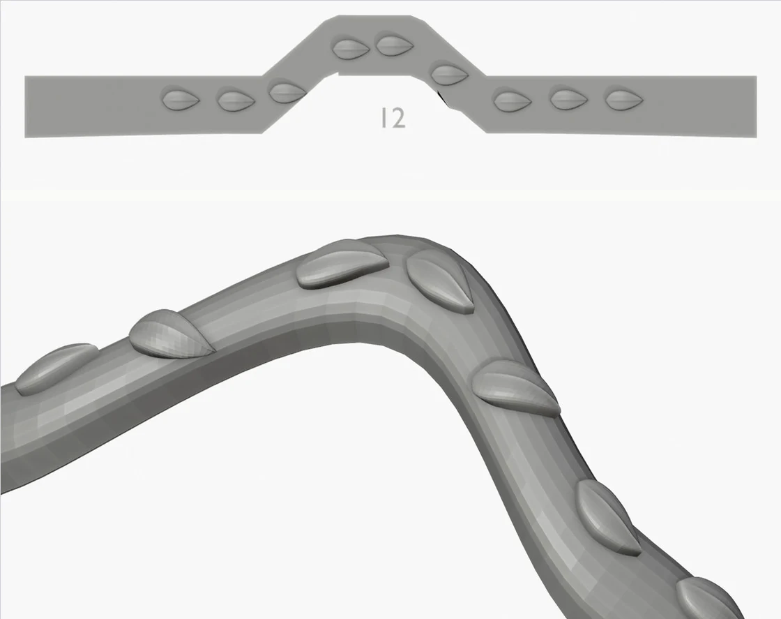 A wishbone band with a row of drops, first version: the guide above is stepped and the drops on the slope are sheared