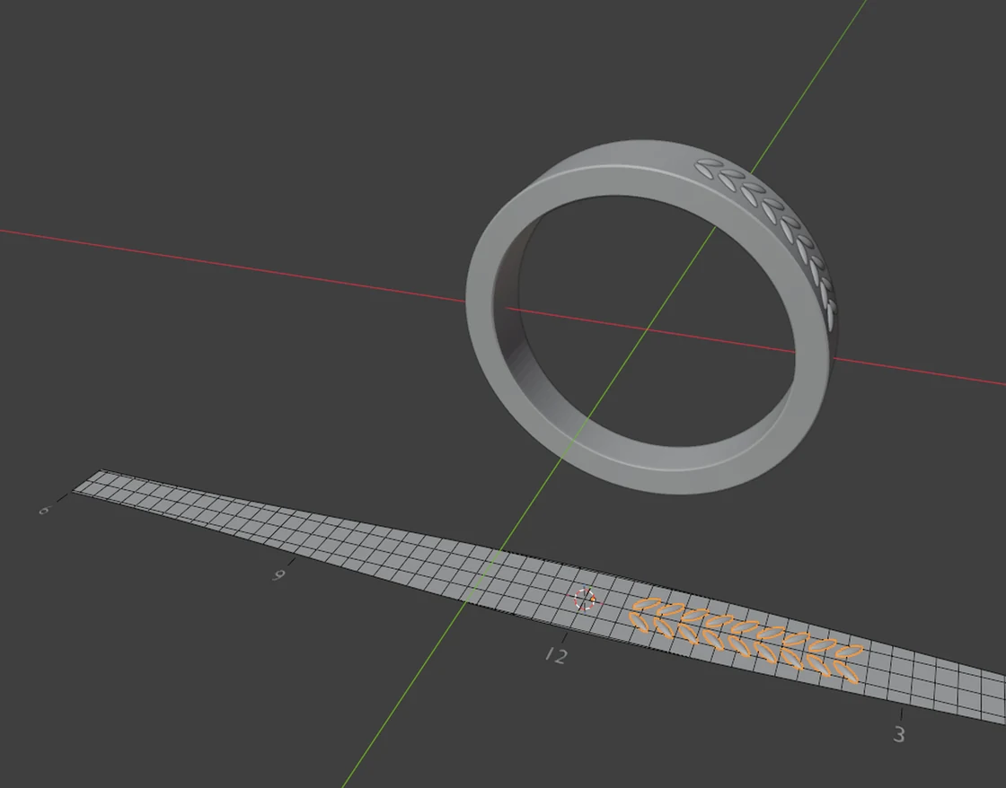 The CAD/CAM Jeweller add-on in Blender: a ring above, and its outer face laid flat below as a guide with a one millimetre grid and o'clock marks, a row of leaves drawn on the flat guide